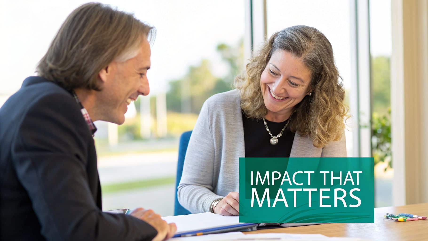 Staff collaborating on an annual report template around a table