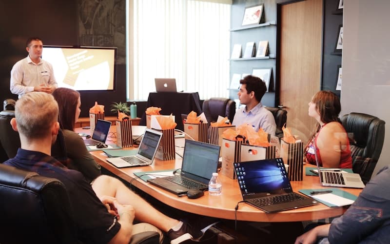 Nonprofit director reviewing ai nonprofit accounting software with the leadership team