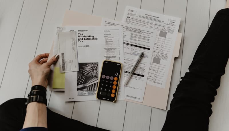 Tax forms calculator and envelope used for nonprofit financial reporting