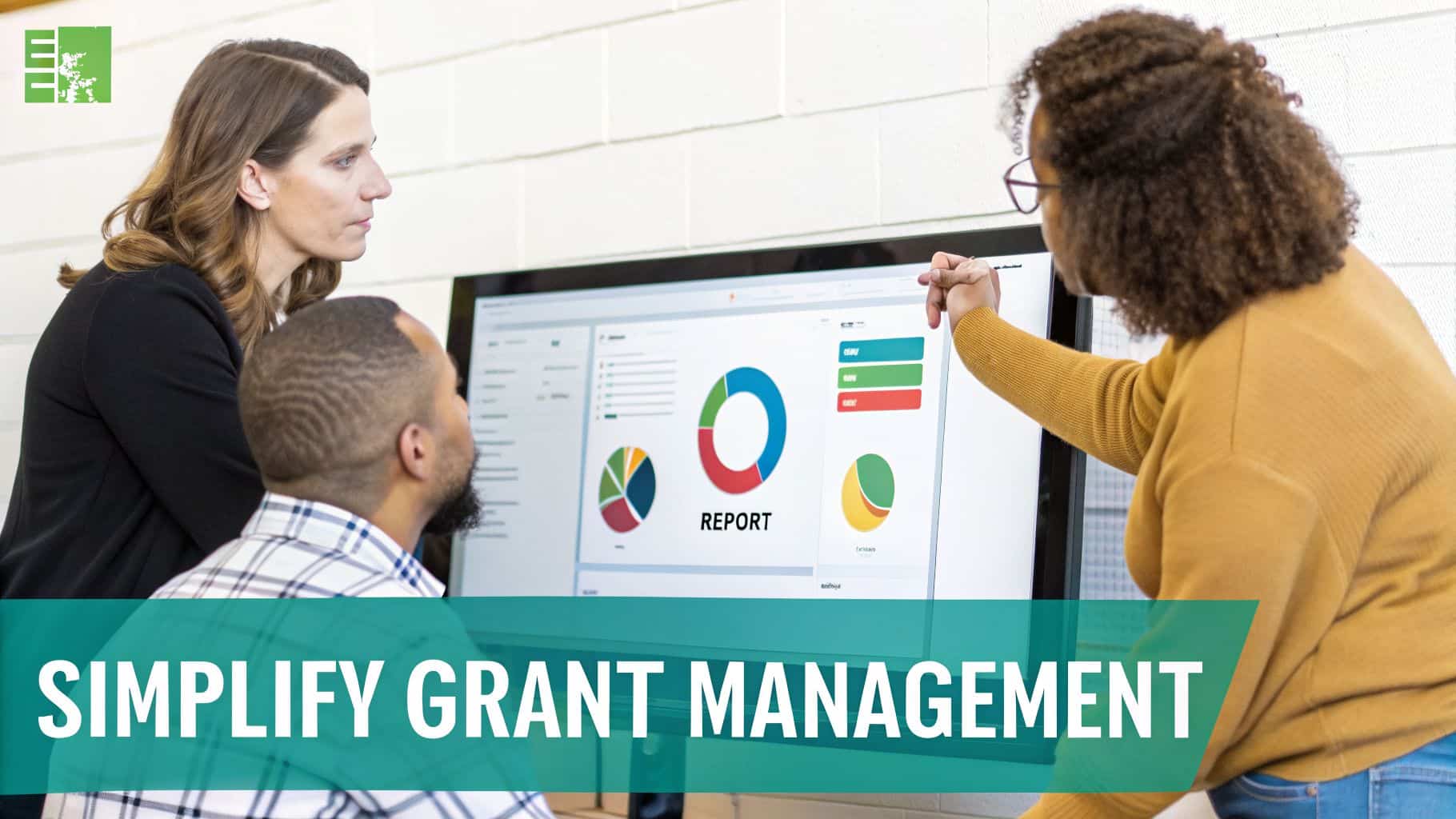 Diverse team collaborates on a computer screen showing grant management data and reports