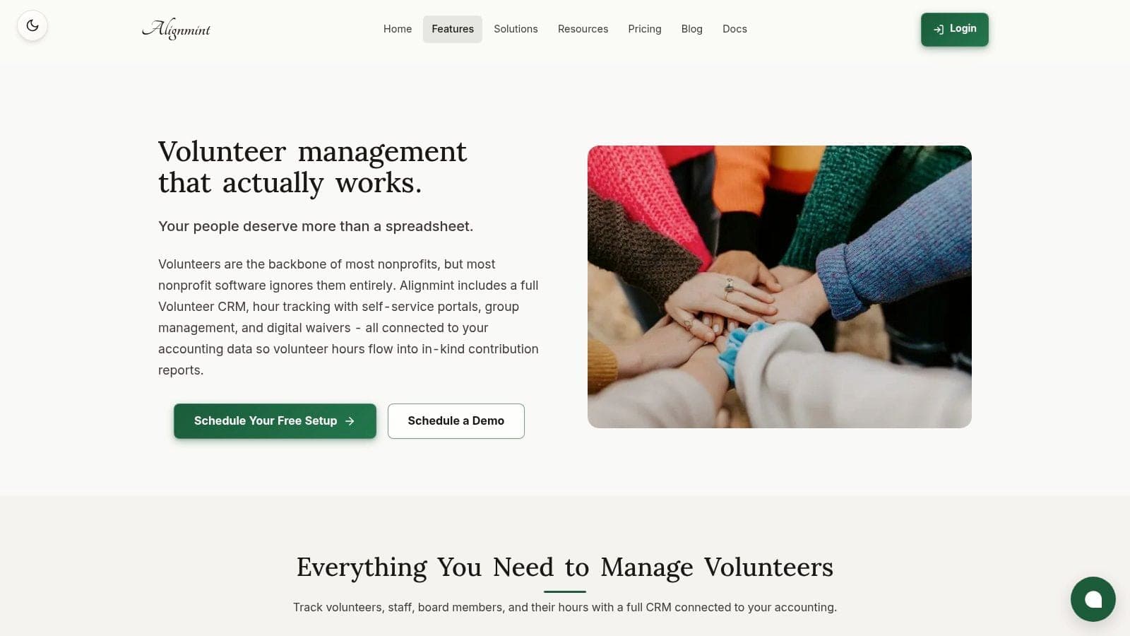 Company volunteers joining hands before a community service project