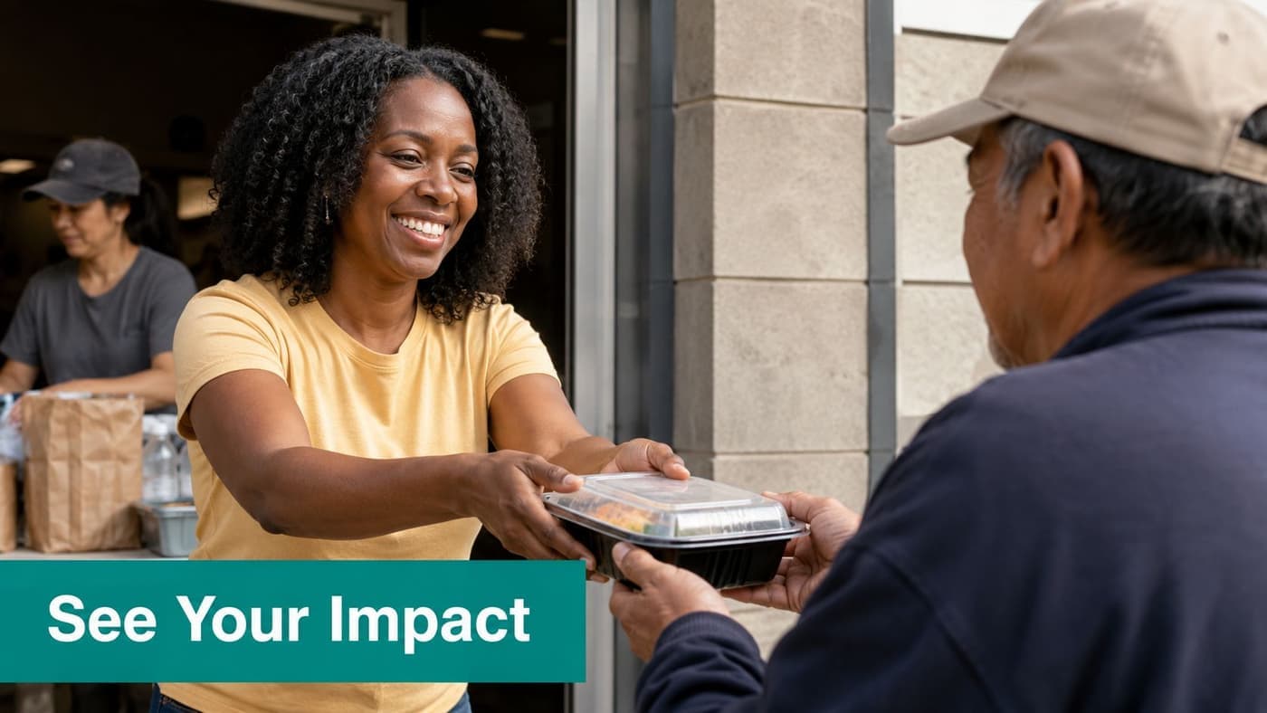 Volunteer handing fresh food to a community member