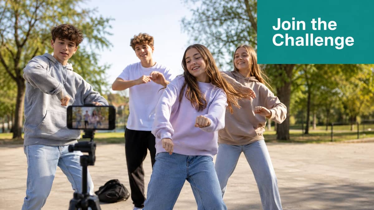 Teenagers recording a youth group fundraising challenge video in a park